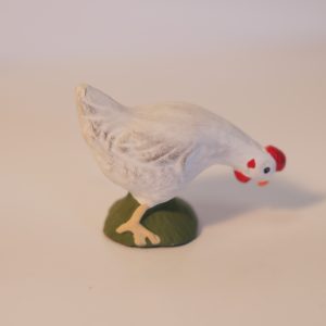 Poule picorante blanche